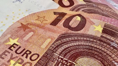 A detailed close-up image of a ten Euro bill, showcasing the intricacies of European currency.