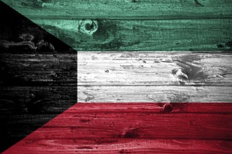 Kuwait flag on wooden planks background wood flag