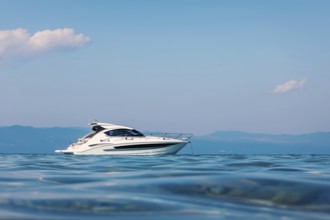 Motor boat floating on clear turquoise water