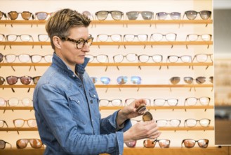 An image of a woman in a eyewear store