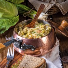 Young and fresh cabbage cooked with bacon cubes
