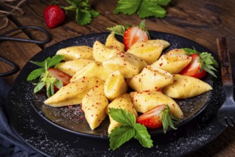 Kopytka Polish potato dumplings with strawberries