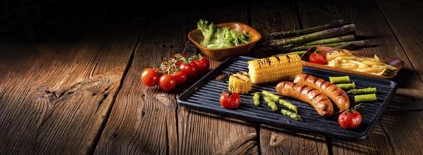 Grilled krakauer with french fries and green salad