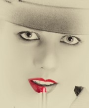 Portrait of a stylish woman with a hat and bright red lips