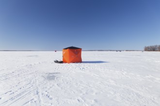 Winter, icefishing tent on the frozen Saint Lawrence River, Province of Quebec, Canada