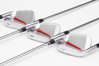 Titanium golf clubs on the white background