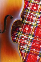 Photo of old violin on Christmas decoration. Winter holidays. Merry christmas and happy new year