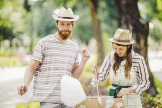 Theme is a family small business cooking sweets. A pair of lovers A young man and woman trader in
