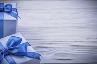 Set of wrapped present boxes on wooden board copy space celebrations concept