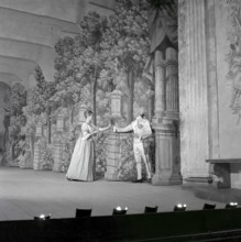 As if in the 18th century. Actors Jarl Kulle and Maj-Britt Nilsson in a scene taken inside the