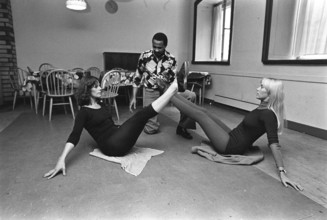 The pop group ABBA. Its two female members Anni-Frid Lyngstad and Agnetha Fältskog practice and