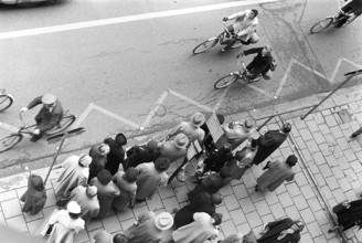 Bus stop in Stockholm in 1953. People are waiting for the bus at the bus stop. Stockholm Sweden
