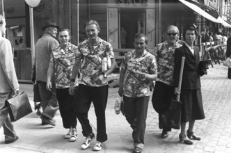 The four tourists 1954. Four men on a street are wearing the same type of shirt. Sweden