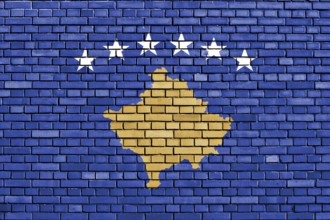 Flag of Kosovo painted on brick wall