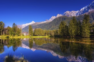 The mountain resort of Chamonix, Haute-Savoie. City Park is illuminated by the setting sun. The