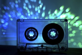 Transparent Cassette tape and blue color disco light background