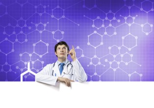 Young handsome doctor holding white blank banner. Place your text