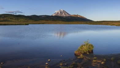 Stunning evening panoramic mountainous landscape of Kamchatka Peninsula at sunset: scenery autumn