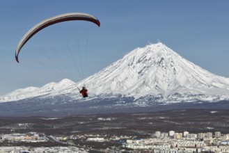 PETROPAVLOVSK-KAMCHATSKY, KAMCHATKA, RUSSIA, NOVEMBER 21, 2014: Paraglider flying over