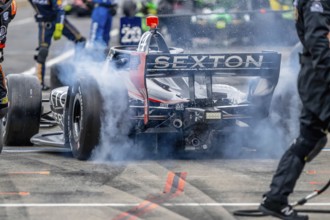 INDYCAR Series driver, SANTINO FERRUCCI (14) of Woodbury, Connecticut, brings his car in for
