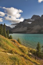 Northern lake surrounded by a wood and mountains in Canada