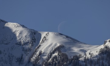 Mountain panorama, snow, crescent moon, Pinzgau