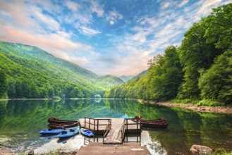 Boats near pier on Biogradskoe lake in mountains of Montenegro