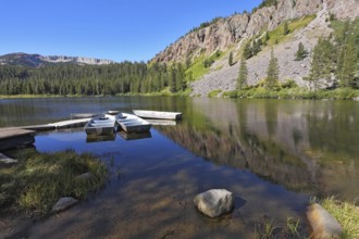 Small boats made of white metal on a quiet mountain Mammoth lake