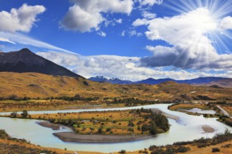 Beautiful summer morning in Patagonia. Island in the middle of the river and the snow-capped