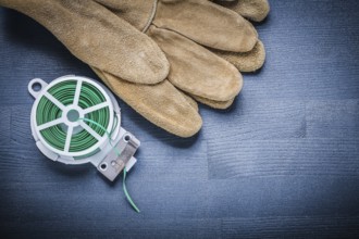 Working glove and rolled garden wire