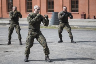 LEGNICA, POLAND, APRIL 26, 2023: Military picnic as part of the Cyber Mil Academy program. Hand to