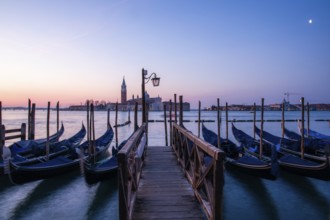 Dawn, Venetian gondolas with the church of San Giorgio Maggiore in the background, Venice, UNESCO