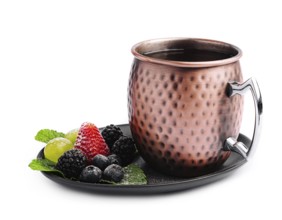 food still-life, Metal camp mug with tea with berries