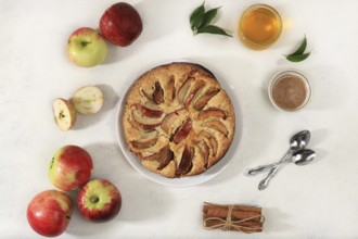 Kitchen background with apple pie, honey, apples, spices, cozy warm concept, hello autumn, hygge