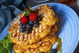 Simple sweet waffles with raspberries and blueberries