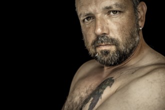 An image of a handsome man with a beard