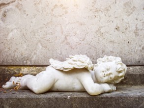 An image of a sleeping angel grave statue