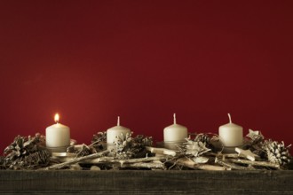 Advent time one candles burning with red background for your content