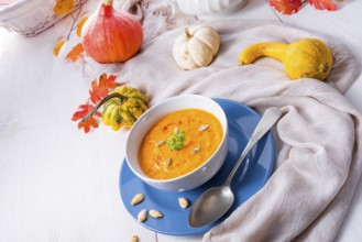 Healthy pumpkin soup with ginger carrots and coconut milk