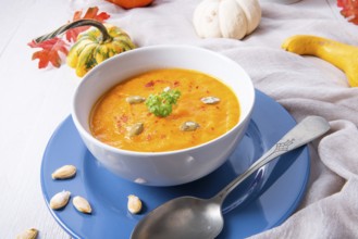 Healthy pumpkin soup with ginger carrots and coconut milk
