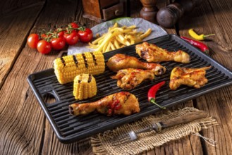 Rustic Grilled chicken wings, legs, and spicy corn