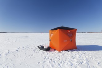 Winter, icefishing tent on the frozen Saint Lawrence River, Province of Quebec, Canada