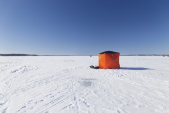 Winter, icefishing tent on the frozen Saint Lawrence River, Province of Quebec, Canada