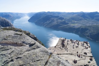 PULPIT ROCK, NORWAY, JULY 26, 2018: Unknown tourists enjoying the stunning view on Pulpit Rock. The