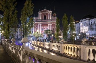 Famous Three Bridges and the Preseren square in the center of Ljubljana illuminated at night,
