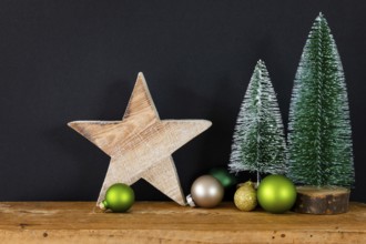 A Christmas decoration black background with tree glass balls and star