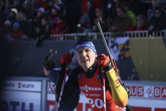 Justus Strelow (SG Stahl Schmiedeberg/GER) with an anxious look at the scoreboard at the IBU