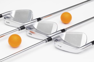 Titanium golf clubs on the white background
