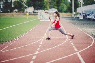 Sports fitness Caucasian women doing warm-up before exercise. Athlete stretching legs doing warm-up