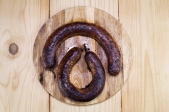 Fried Sausages On a Wooden Board